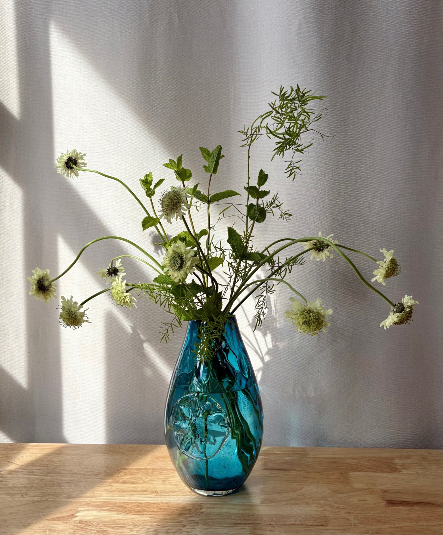 Turquoise Vase with Flower Emblem